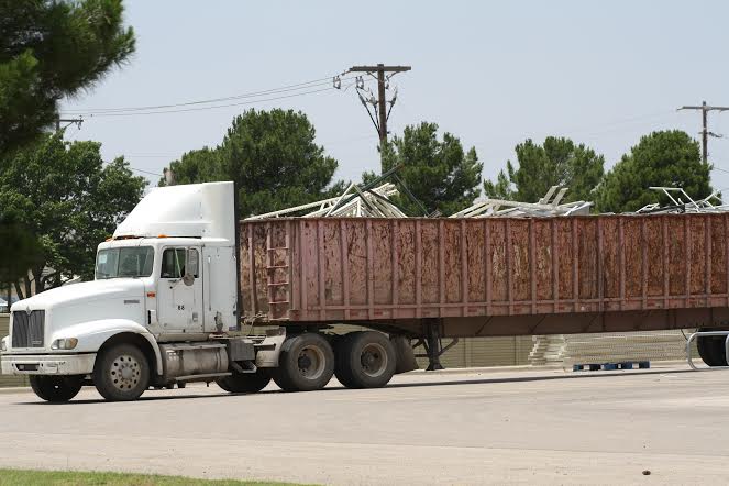 From the Midland, TX. Walmart where they are hauling away the old to make way for the new.  Who are they making room for?