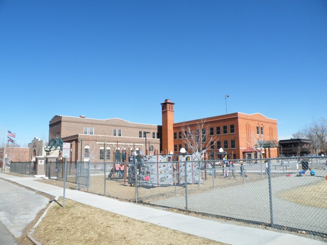 Prison fencing and a guard tower at this Denver Public School.